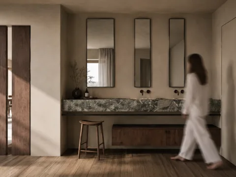 La zona make-up e lavandini di Casa AM, con superfici continue
