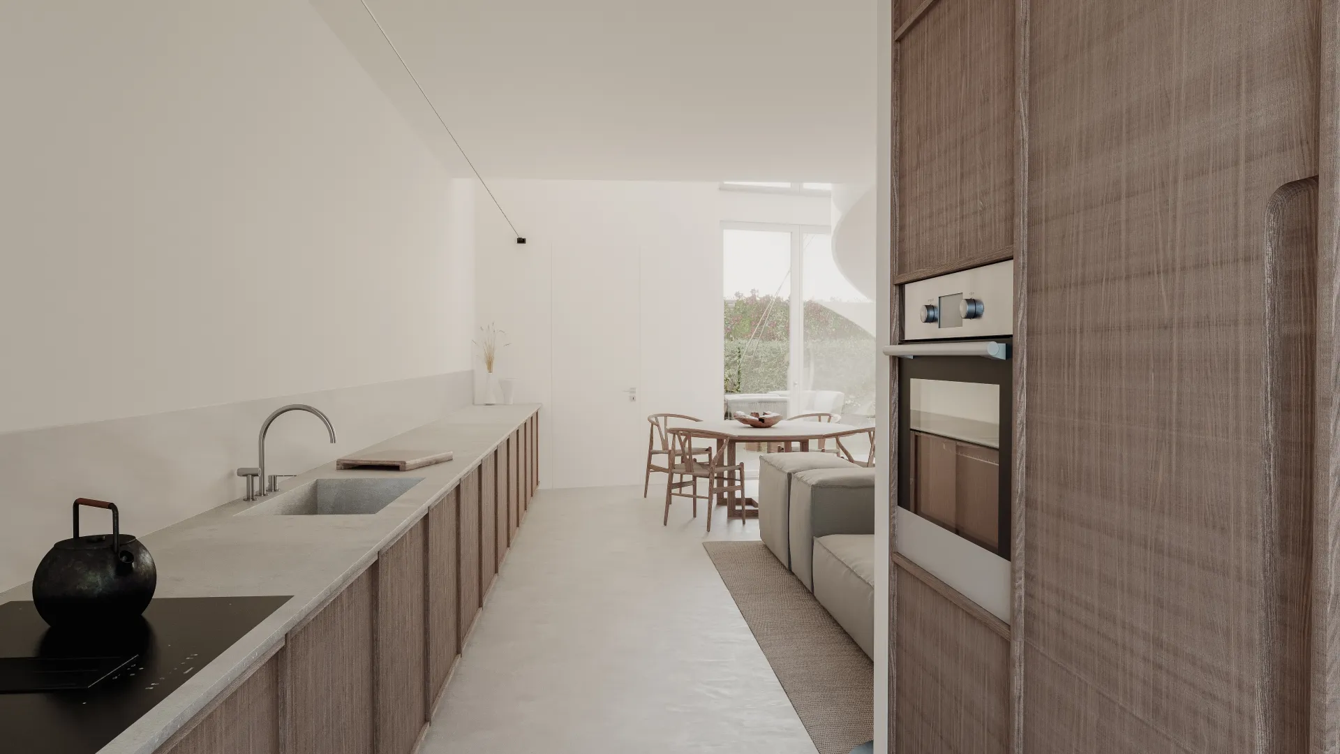 La cucina lineare di Villetta F sotto la tesata di luce, con la colonna in paglia di Vienna